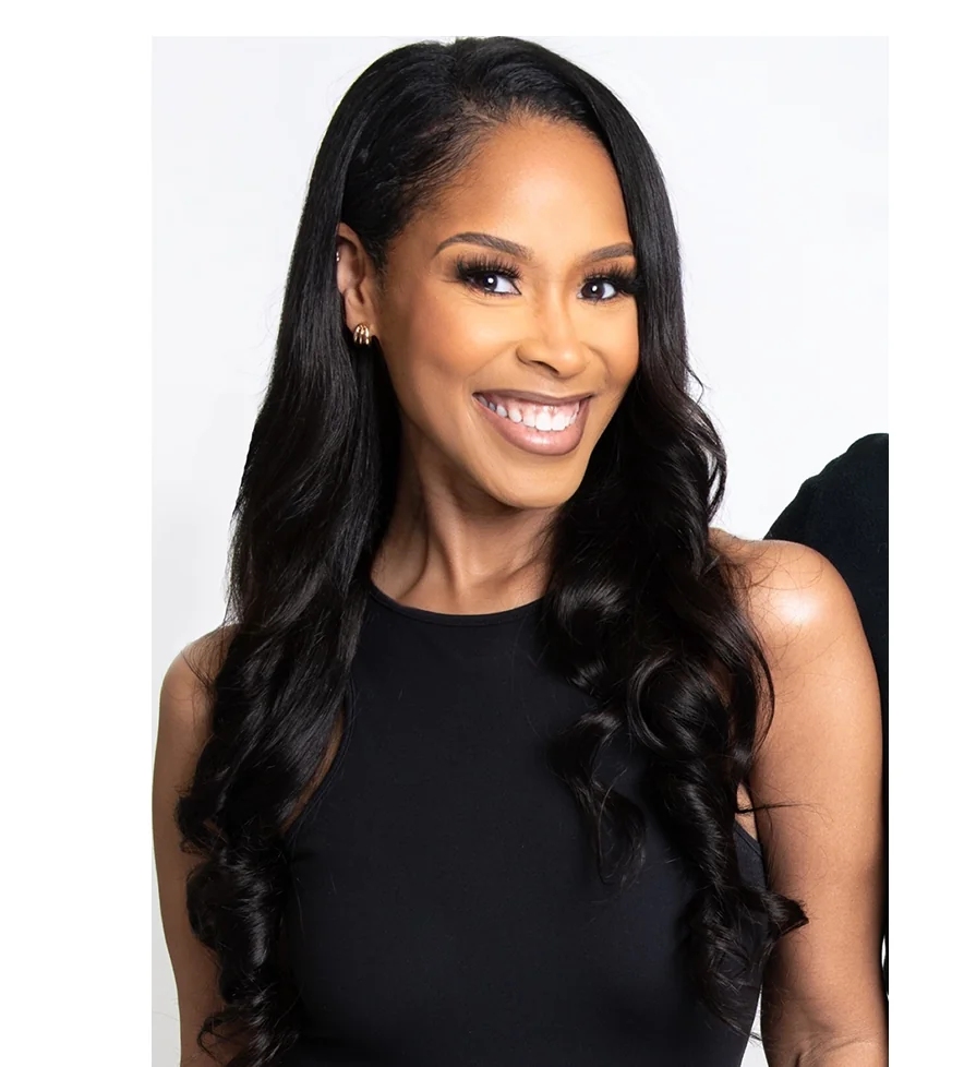 Winter Henderson smiling in a black outfit
